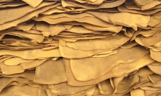 A pile of natural rubber sheets
