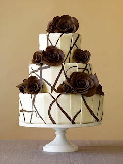 A modern wedding cake with chocolate roses.