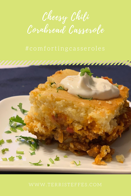 Warm Cheesy Chili Cornbread Casserole on a white dish.