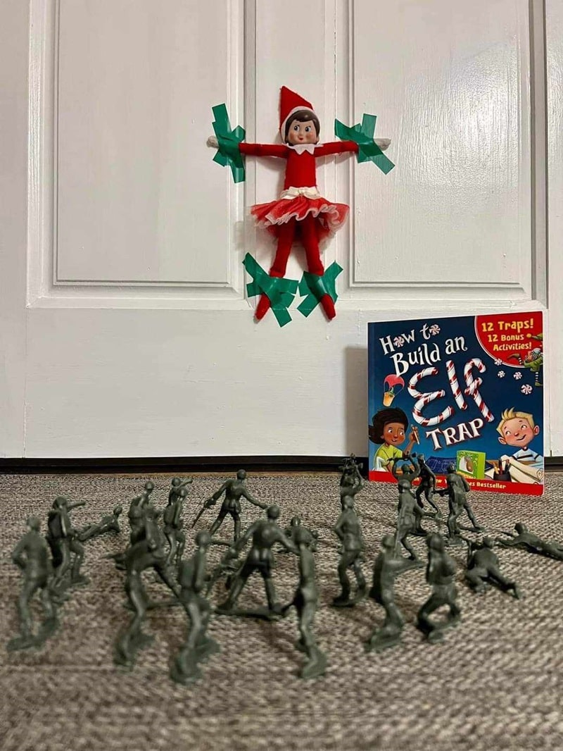 elf being held hostage by army men.