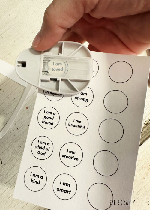 Punch out circles with affirmations.