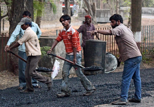 workers tarring road