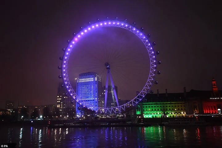 British landmarks are lit in purple due to the Holocaust. Pictures