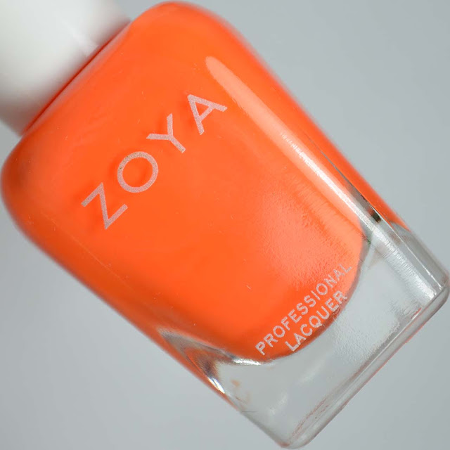 matte neon orange nail polish in a bottle