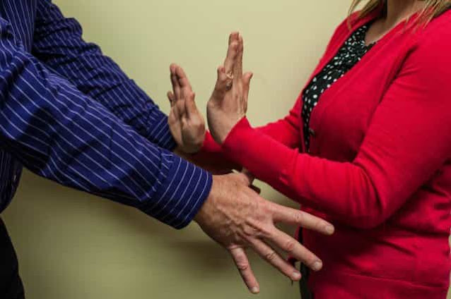 Woman and Red Dress Fends of Groping Hands