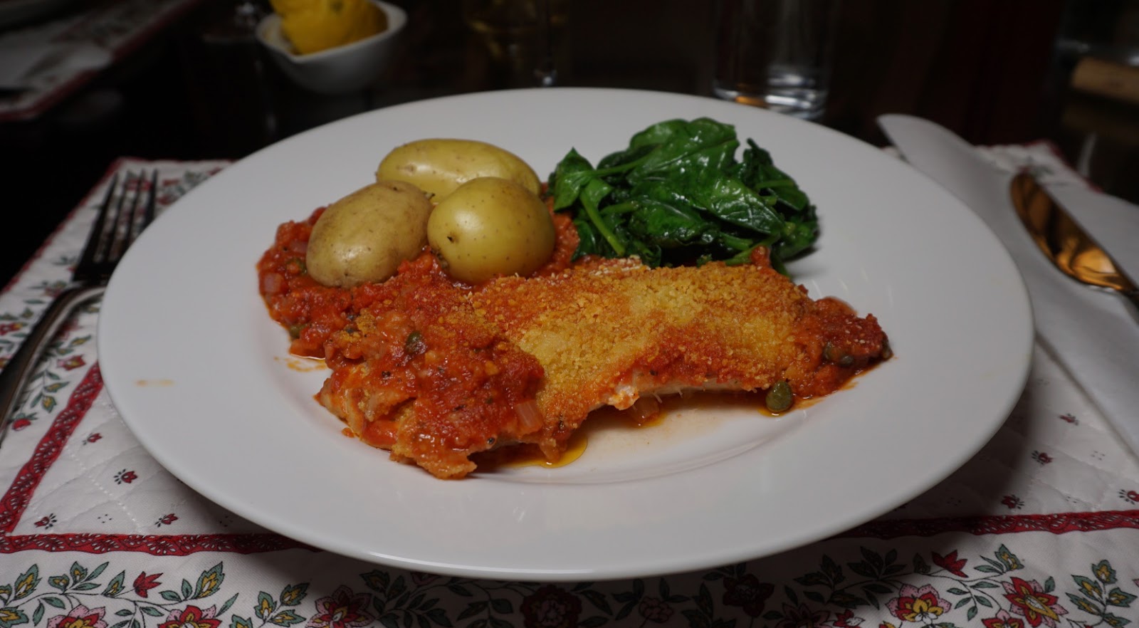 Baked white fish in tomato sauce and capers