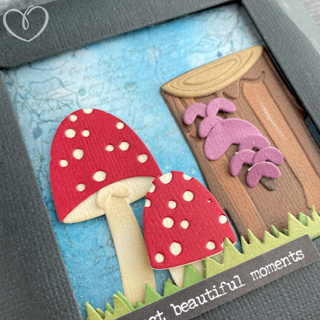 Mushroom and tree stump panel made with cardstock, stamps and die cuts.