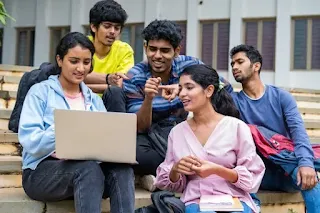 group of students using laptop