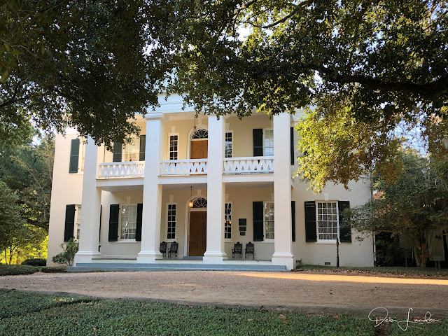 The tree-shrouded main building at Monmouth Historic Inn, Natchez.