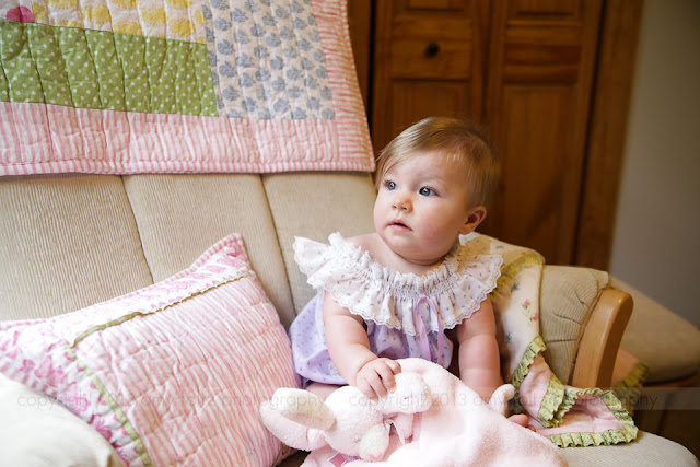 photo of a baby girl in her nursery