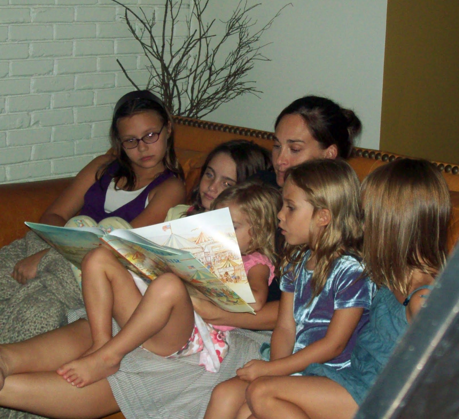 small bathroom tubs Cassie reading to the little girls before bed.