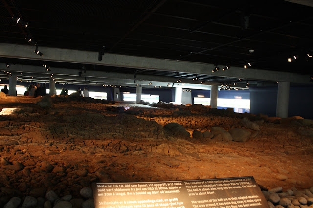 Intact walls of a Viking longhouse in The Settlement Exhibition in Reykjavik, Iceland.