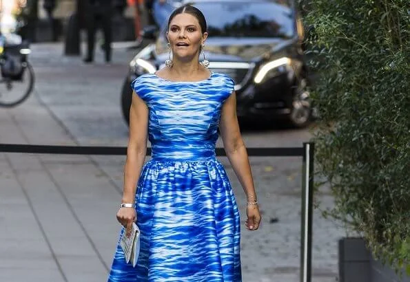 Crown Princess Victoria wore a Camilla Thulin sea blue print dress, Anya Hindmarch metallic clutch