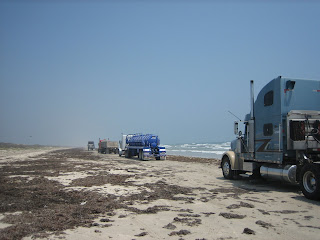 Firm beach road with trucks, Padre Island National Seashore