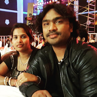 Arjun janya and his wife
