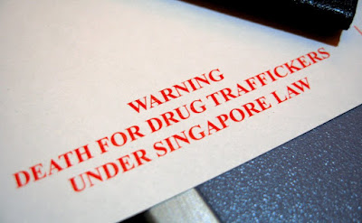 A Singaporean immigration card warns about the death penalty for drug trafficking offences.