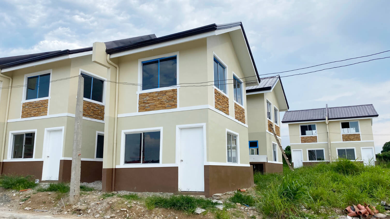 Photo of Woodlands Trece Martires - Jasmine Single Attached | House and Lot for Sale Pag-IBIG Trece Martires Cavite | AXEIA Development Corporation