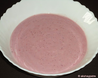 milk mixture and strawberry puree in a bowl