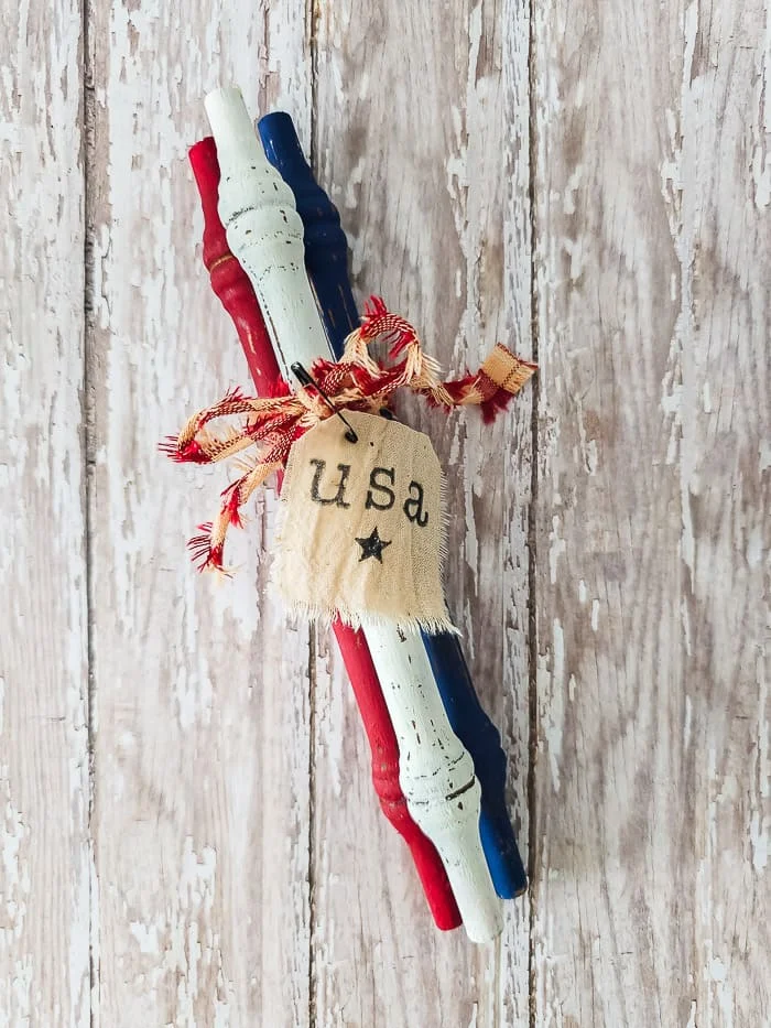 red, white blue spindles, homespun bow, stamped tag