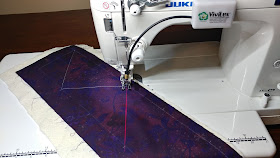 Dot to dot quilting with a sewing machine laser