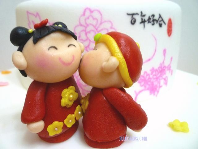 On the bottom tier an adorable Chinese couple in red traditional wedding 
