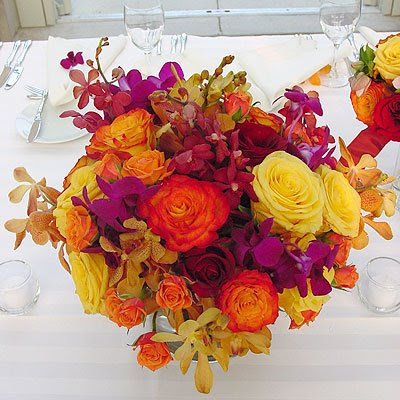 Rose Centerpiece on Vibrant Orange And Yellow Rose Centerpiece With Purple And Yellow