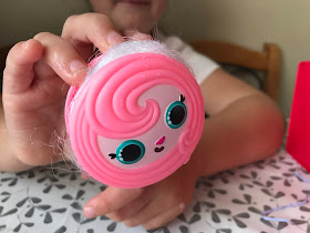 pink animal face roller with pop pop hair hidden inside 