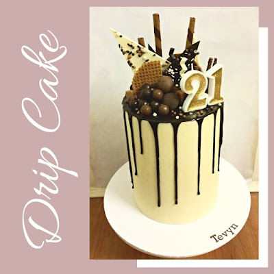 Drip Cake, White Ganache and Choclate Drip.  Chocolate balls and Bark as the topper. 21st Birthday