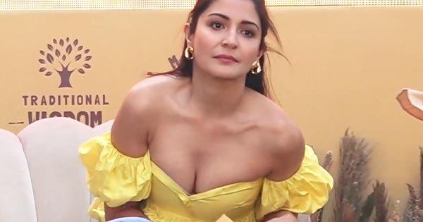 Anushka Sharma wardrobe malfunction - shows her bra in cleavage baring tiny  yellow top.