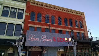 Vinyl sign on front of building: Lace, Grace & Gears