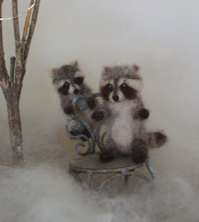 Raccoons in snow