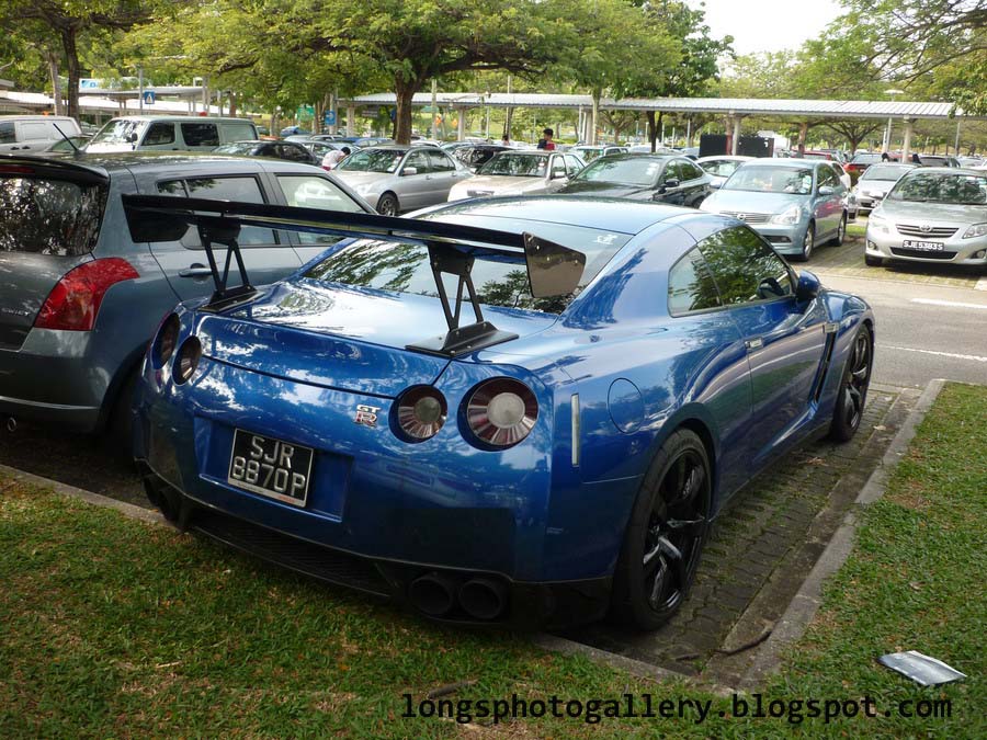 Modified Nissan GTR with carbon fiber bonnet and GT wing