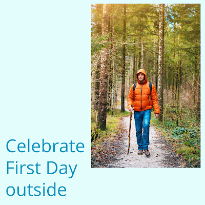 Man dressed in warm clothing hiking in the woods