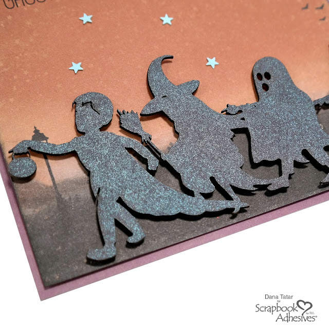 Glimmer Misted Trick-or-Treat Silhouette Chipboard Embellishment with Black 3D Foam Circles on a Halloween Card