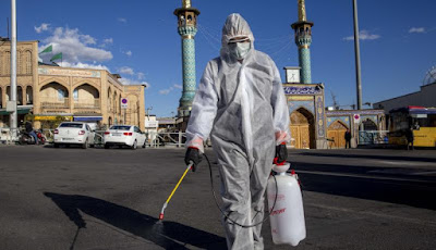 Spraying disinfectant at Tajrish bazaar in Tehran, Iran, during the coronavirus pandemic in March 2020