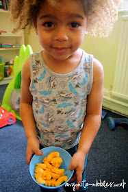 Callum with a bowl of Veronica's cheesy dinosaurs from Anyonita-nibbles.co.uk