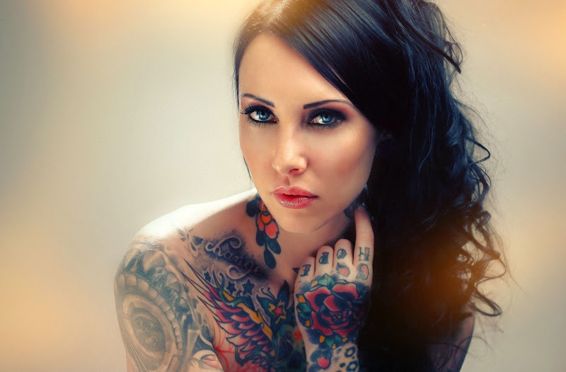 Tattooed Women Wallpaper title=