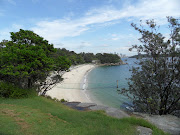 The sun has reappeared as I look back to the beach while walking through . (sam )