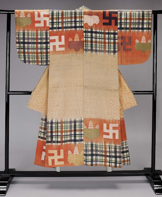 Japanese noh theater robe with large swastikas and colorful patterns.