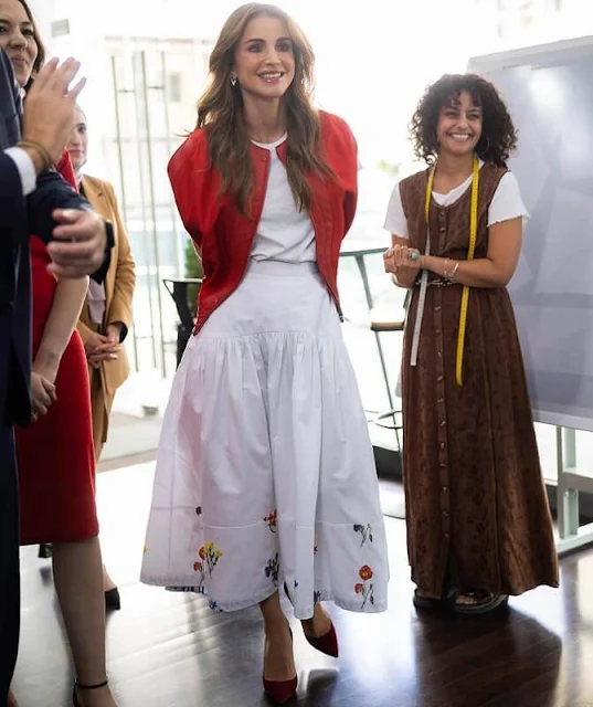 Queen Rania wore an eleonor embroidered drill midi skirt by Silvia Tcherassi. Dior red suede pumps. Nikos Koulis diamond earrings