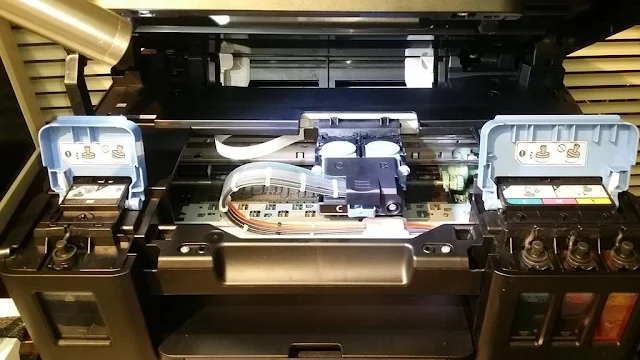 把左右兩個蓋掩放下，把打印機上蓋放下，打印機就可以恢復正常打印