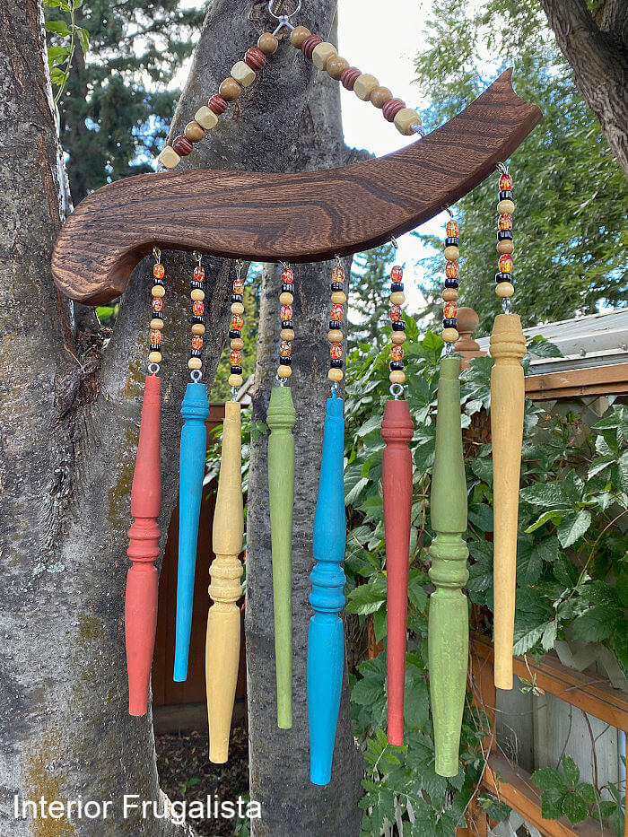 How to repurpose salvaged spindles and an arm from an old wooden chair into rustic outdoor chair spindle wind chimes that cost very little to make.