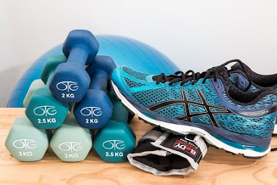 Exercise equipment barbells and running shoes