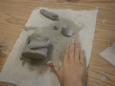 student assembling clay body for terra cotta warrior art lesson