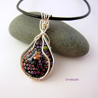 https://umeboshi.indiemade.com/product/argentium-silver-wire-wrapped-dichroic-glass-pendant-handmade-fused-glass-jewelry-dotted-pea