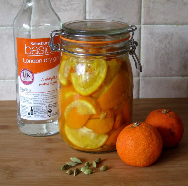 Gin and oranges infusing in a kilner jar