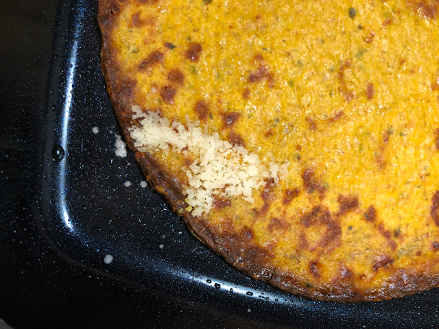 Photo of grated Parmesan cheese covering the entire break