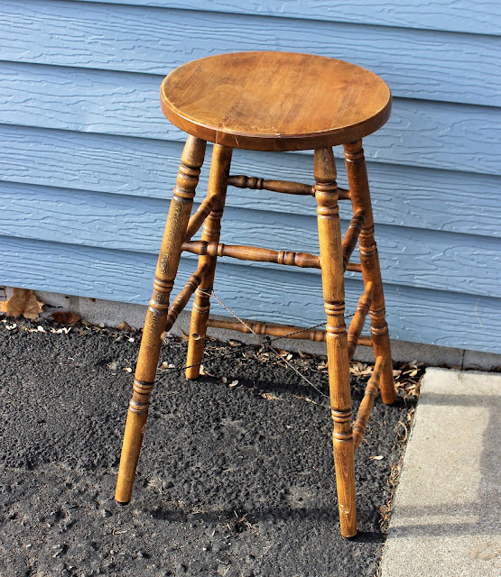 Photo of a vintage spindle leg stool.