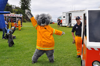 Smokey the bear dances at community event