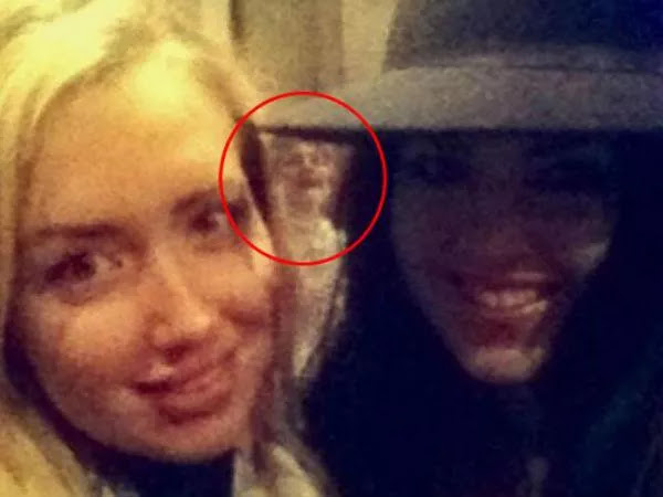 The appearance of a ghost of a laughing woman was accidentally caught in the selfie of these two women